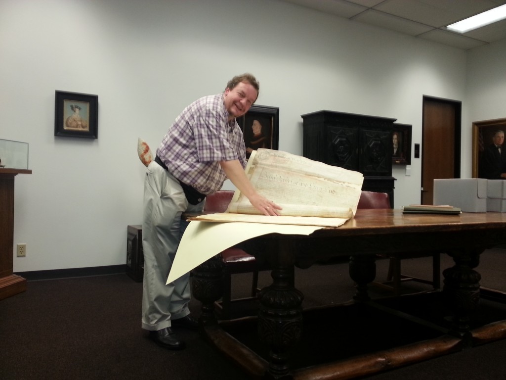 Nicholas Chapman with Ludwell estate documents in Austin, TX.